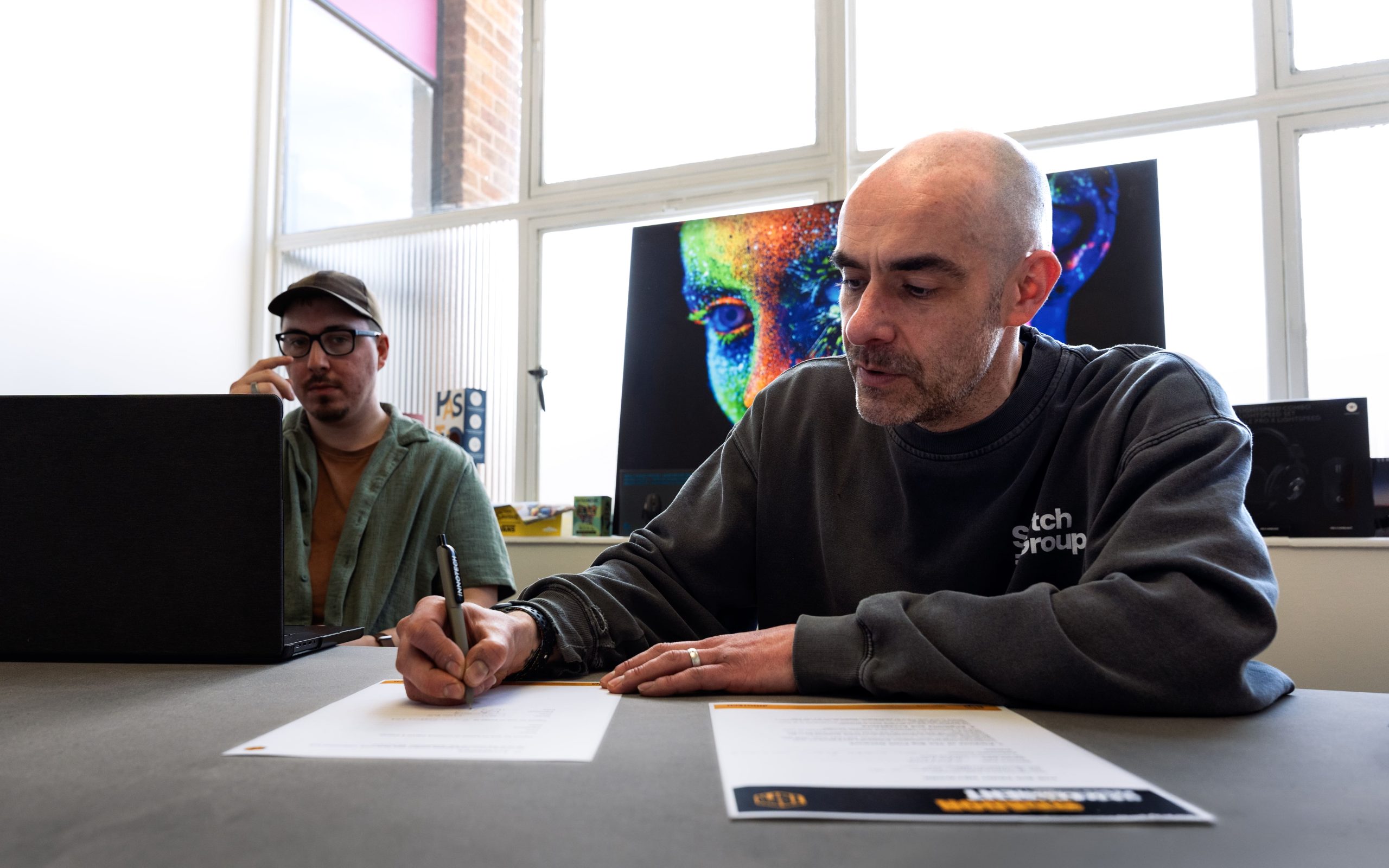 Neil Higgs, Director at Swytch signing the Big Print Network agreement.